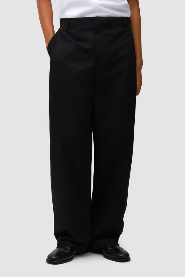Dress Pants in Black worn by a model, half-body front view