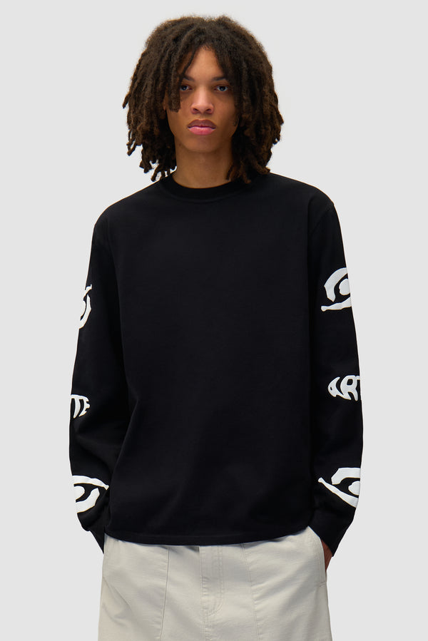 Eye Sleeve Longsleeve in Black worn by a model, half-body front view
