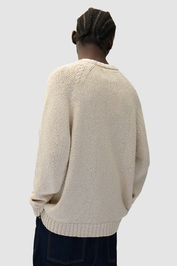 Pixel Front Knit in Cream worn by a model, half-body back view