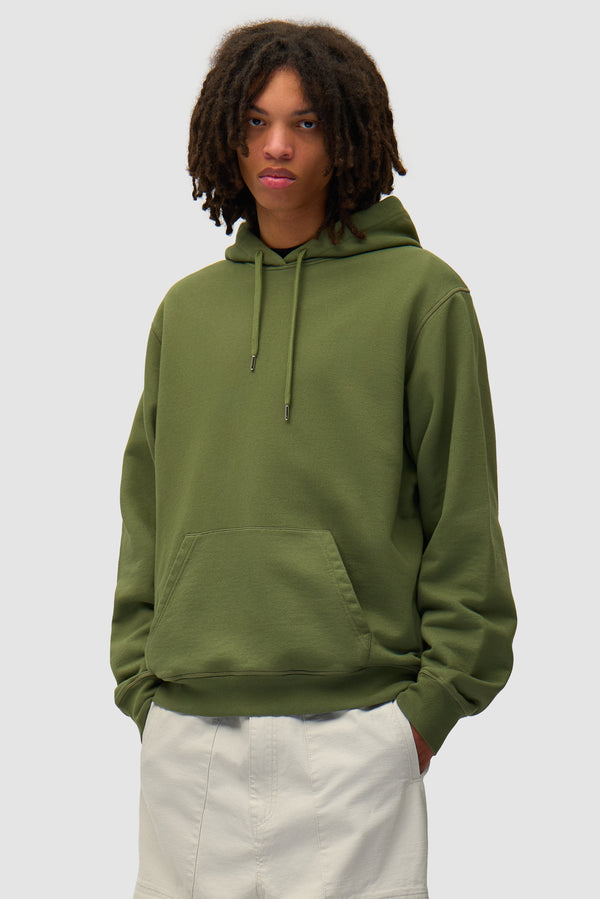 Arte Together Hoodie in Green worn by a model, half-body front view