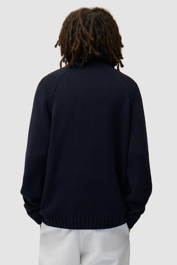 All Together Sweater in Navy worn by a model, half-body back view
