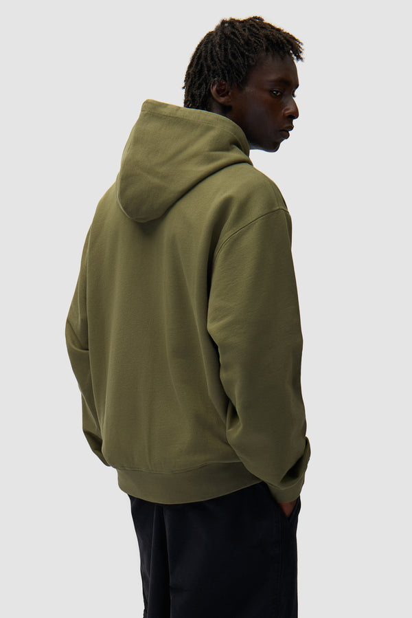 Eye Front Zip Hoodie in Green worn by a model, half-body back view