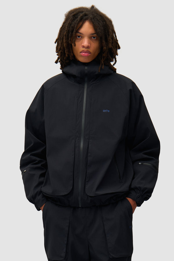 Technical Polar Jacket in Black worn by a model, half-body front view