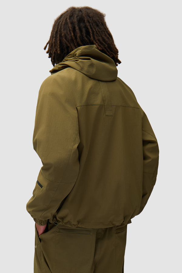 Technical Polar Jacket in Green worn by a model, half-body back view