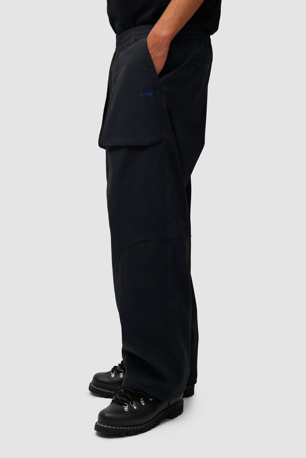 Technical Polar Pants in Black worn by a model, half-body front view