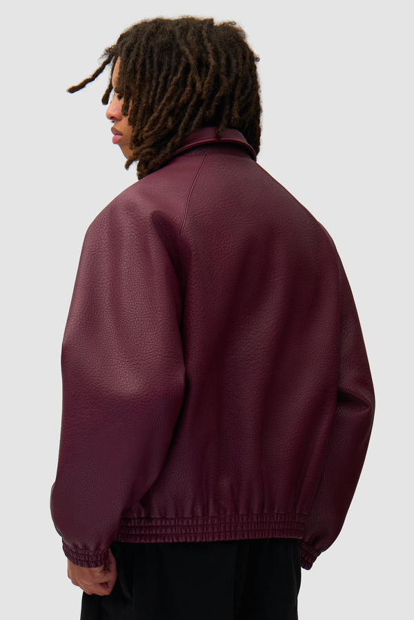 Basic Leather Jacket in Bordeaux worn by a model, half-body back view