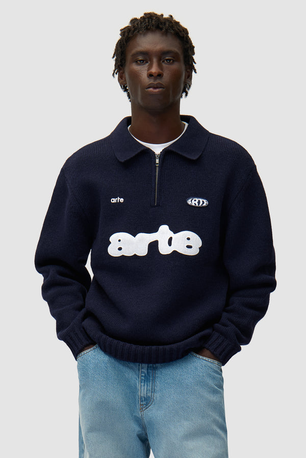 Polo in Navy worn by a model, half-body front view