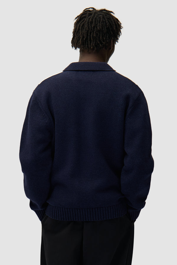 Cardigan in Blue/White worn by a model, half-body back view