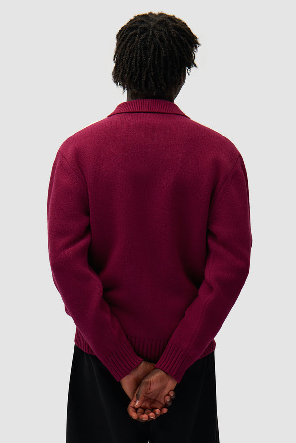 Cardigan in Bordeaux/Cream worn by a model, half-body back view