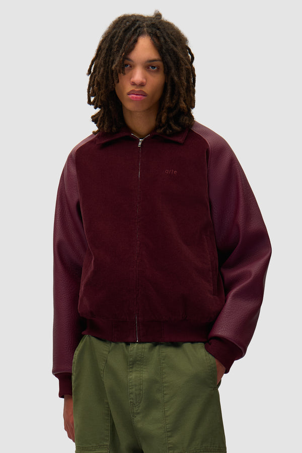 Varsity Jacket in Bordeaux worn by a model, half-body front view