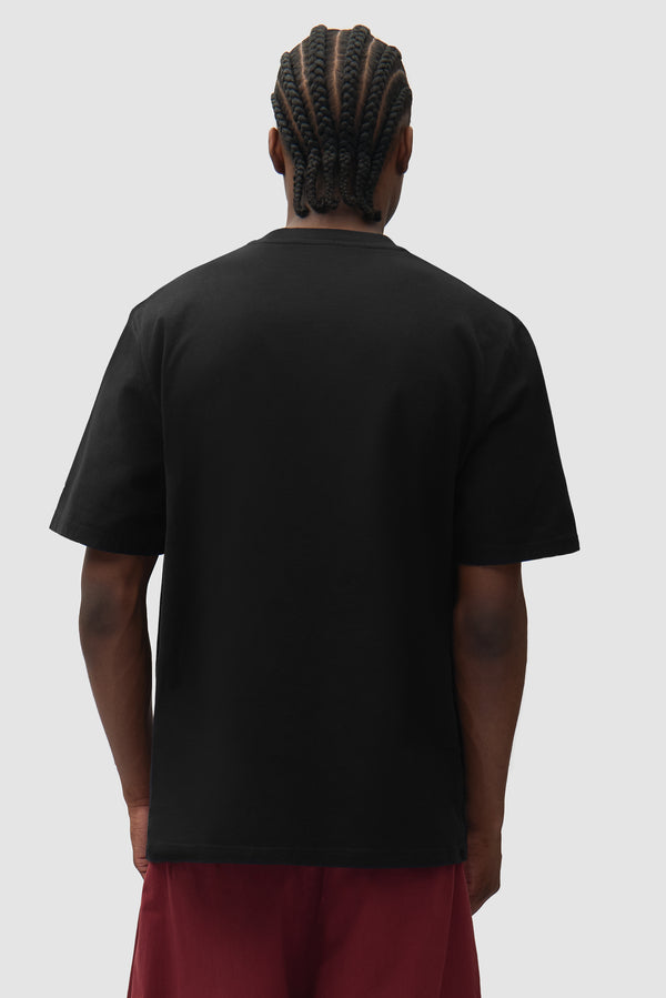 Mohamed Bourouissa T-shirt in Black worn by a model, half-body back view