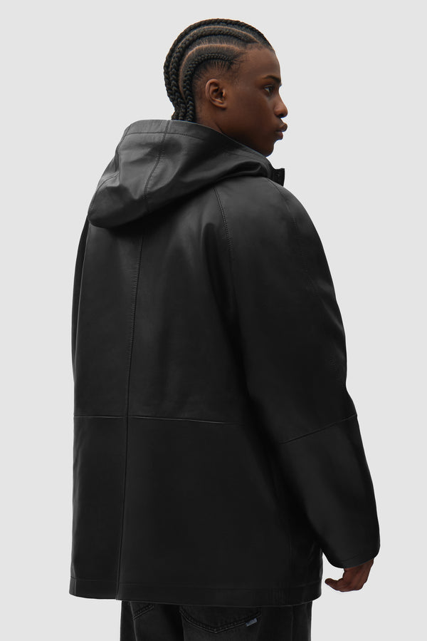 Leather Rain Coat in Black worn by a model, half-body back view
