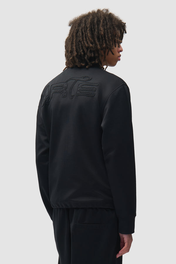 Polyform Nylon Track Jacket in Black worn by a model, half-body front view