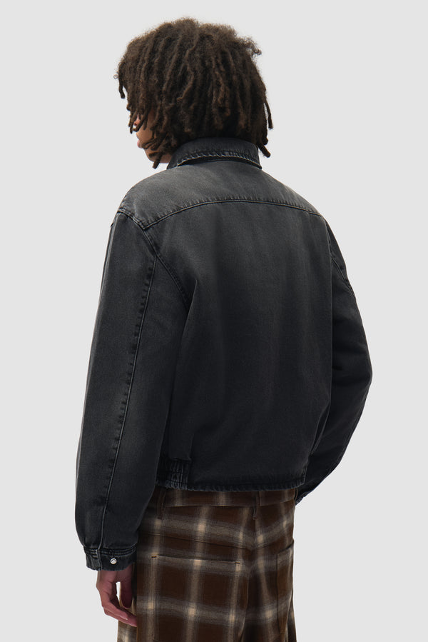 Washed Denim Classic Jacket in Black worn by a model, half-body back view