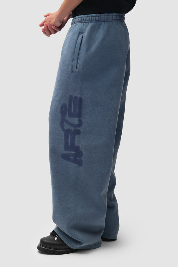 Sunfade Stencil Ease Sweatpants in Navy worn by a model, half-body front view
