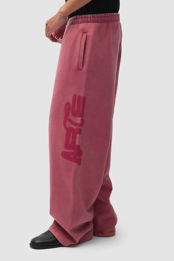 Sunfade Stencil Ease Sweatpants in Red worn by a model, half-body front view