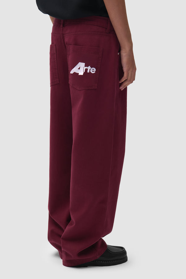 Big A Uniform Pants in Bordeaux worn by a model, half-body back view