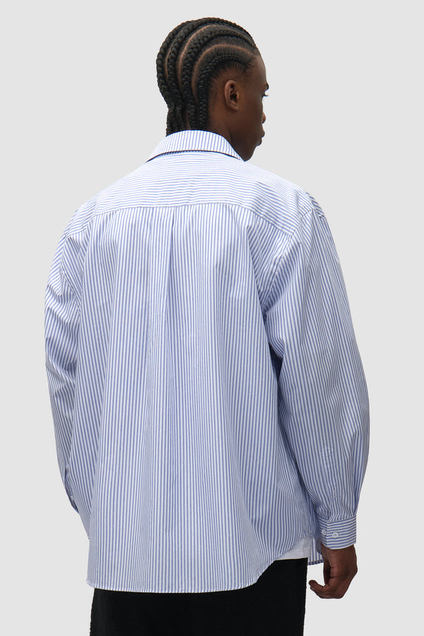 Striped Gallery Shirt in Blue worn by a model, half-body back view