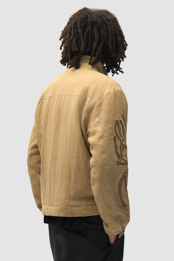 Swirl Utility Jacket in Brown worn by a model, half-body back view