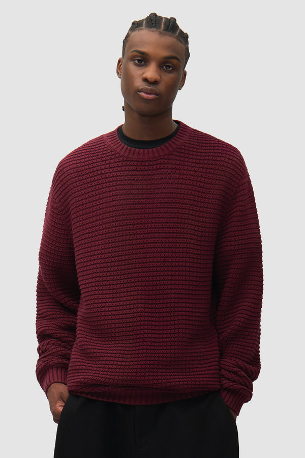 Polyform Sunfade Knit in Bordeaux worn by a model, half-body back view