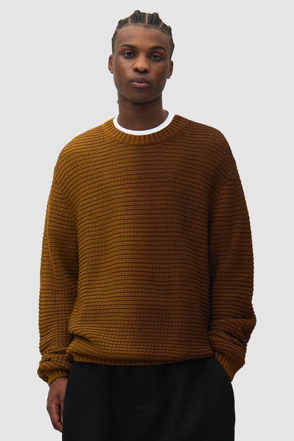 Polyform Sunfade Knit in Brown worn by a model, full-body back view