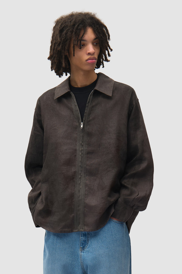 Dusty Linen Zip Shirt in Black worn by a model, half-body front view