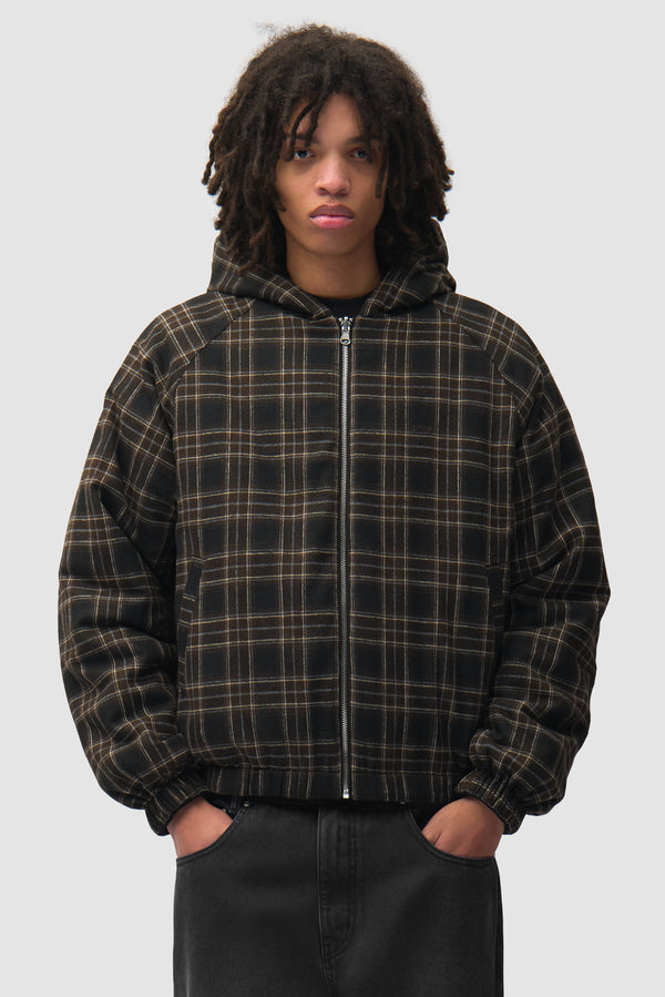 Reversible Plaid Hooded Jacket in Black worn by a model, half-body front view