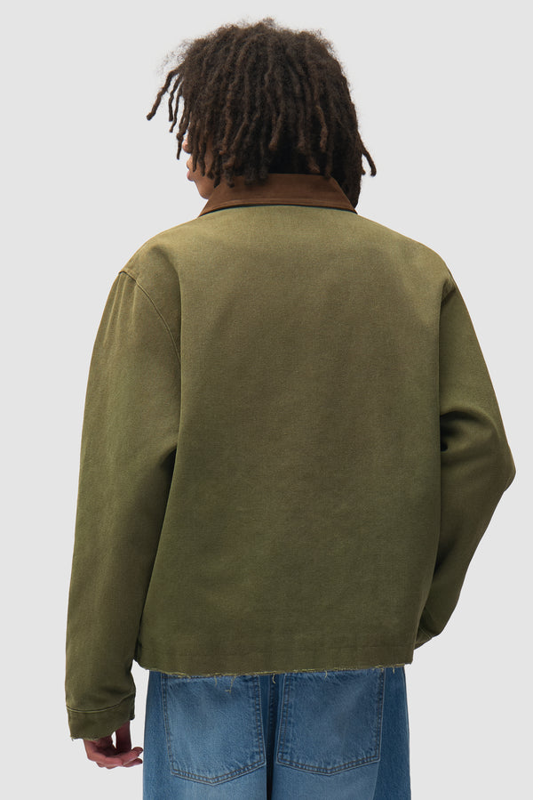 Dusty Artisan Jacket in Green worn by a model, half-body back view
