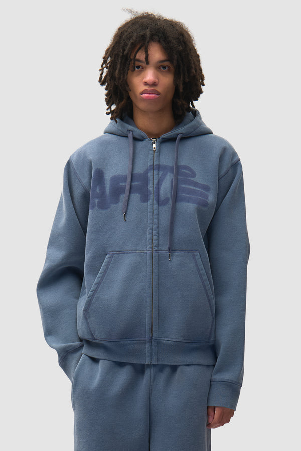 Stencil Sunfade Zip Hoodie in Navy worn by a model, half-body front view