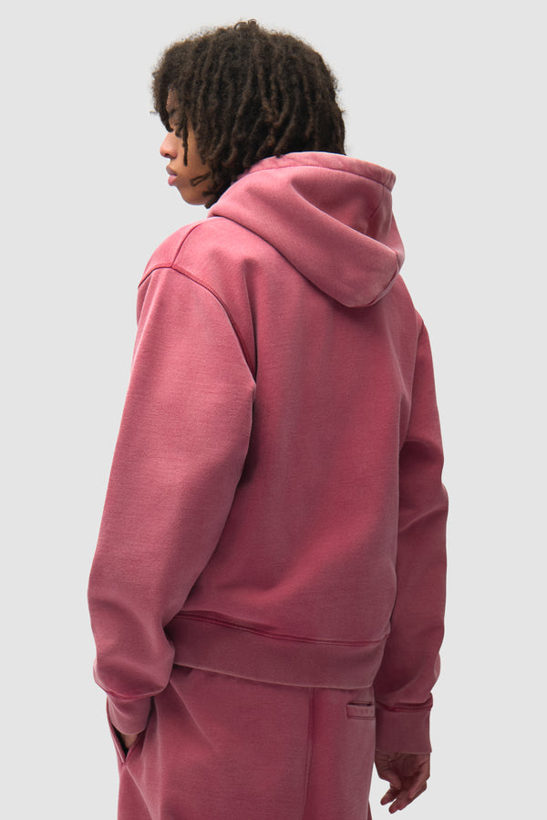 Stencil Sunfade Zip Hoodie in Red worn by a model, half-body back view
