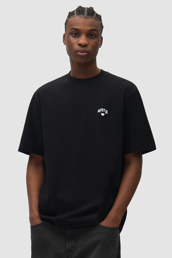 Cor T-shirt in Black worn by a model, half-body front view