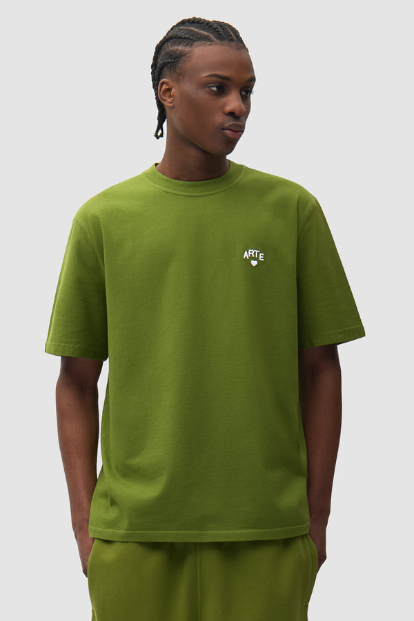 Cor T-shirt in Green worn by a model, half-body front view