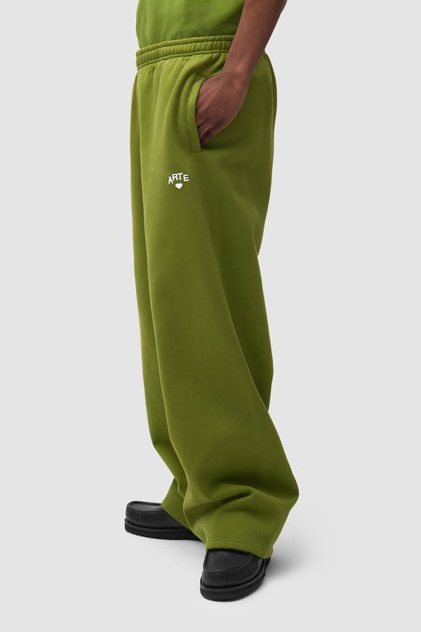 Cor Sweatpants in Green worn by a model, half-body front view