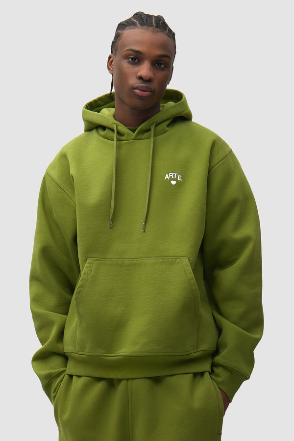 Cor Hoodie in Green worn by a model, half-body front view