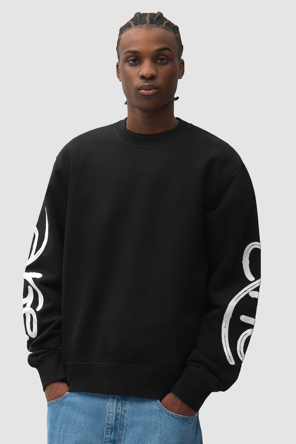 Swirl Crewneck in Black worn by a model, half-body front view