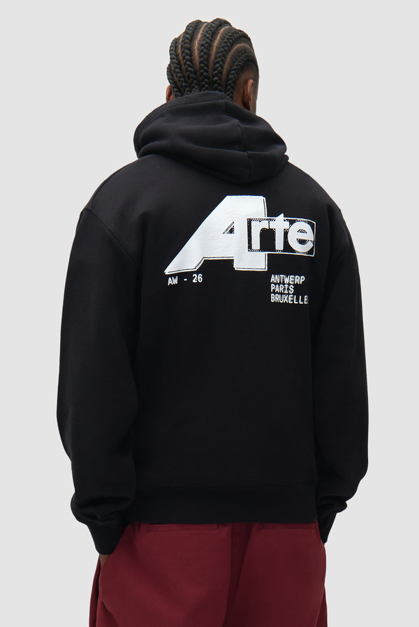 City Hoodie in Black worn by a model, half-body back view
