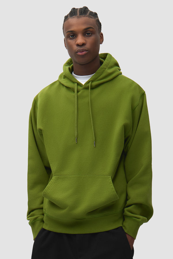 City Hoodie in Green worn by a model, half-body front view