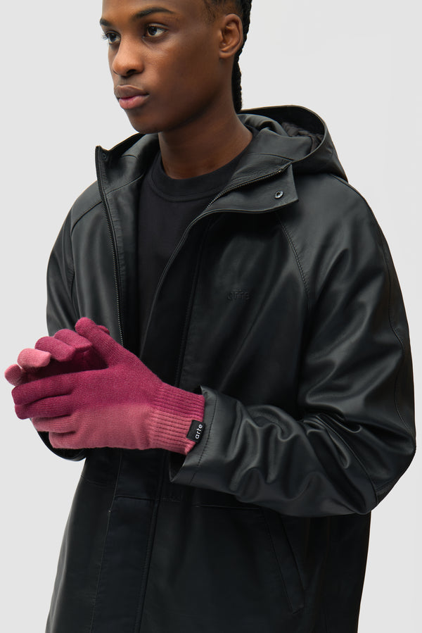 Sunfade Knit Gloves in Bordeaux worn by a model, half-body front view
