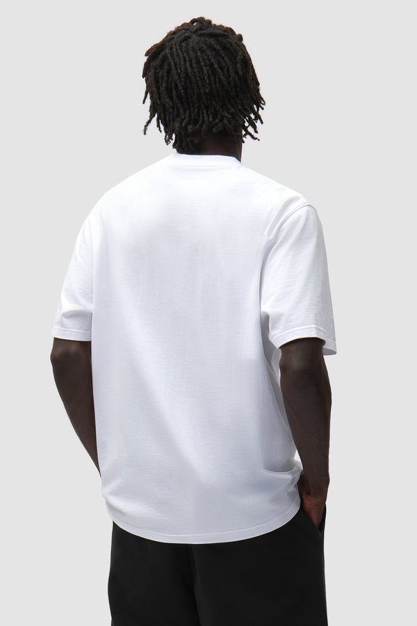 Big A Side T-Shirt in White worn by a model, half-body back view