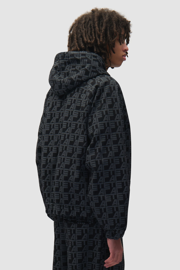 Allover Square Denim Jacket in Black Denim worn by a model, half-body side view