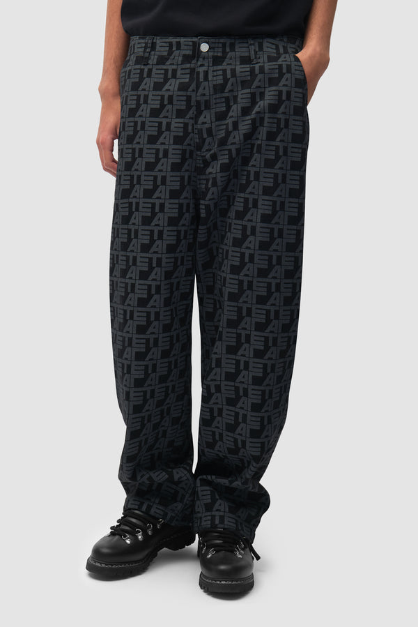 Allover Square Pants in Black Denim worn by a model, half-body front view