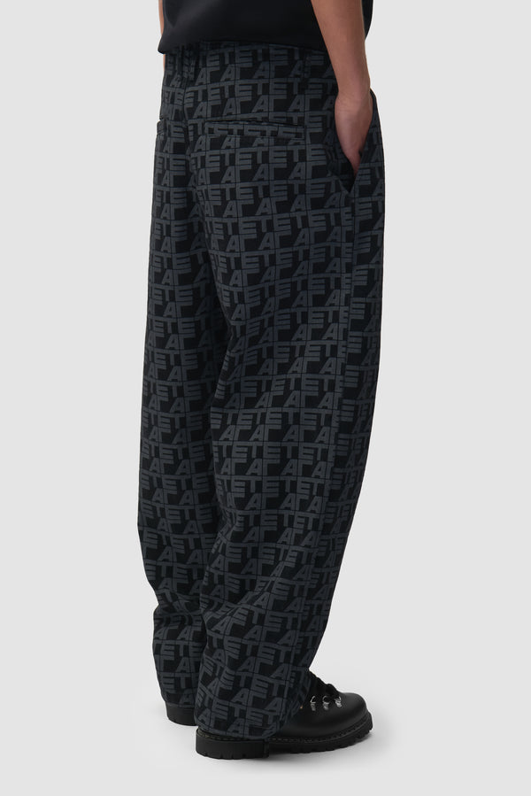 Allover Square Pants in Black Denim worn by a model, half-body side view