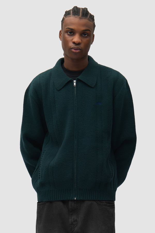 Cable Knit Zip Cardigan in Green worn by a model, half-body front view