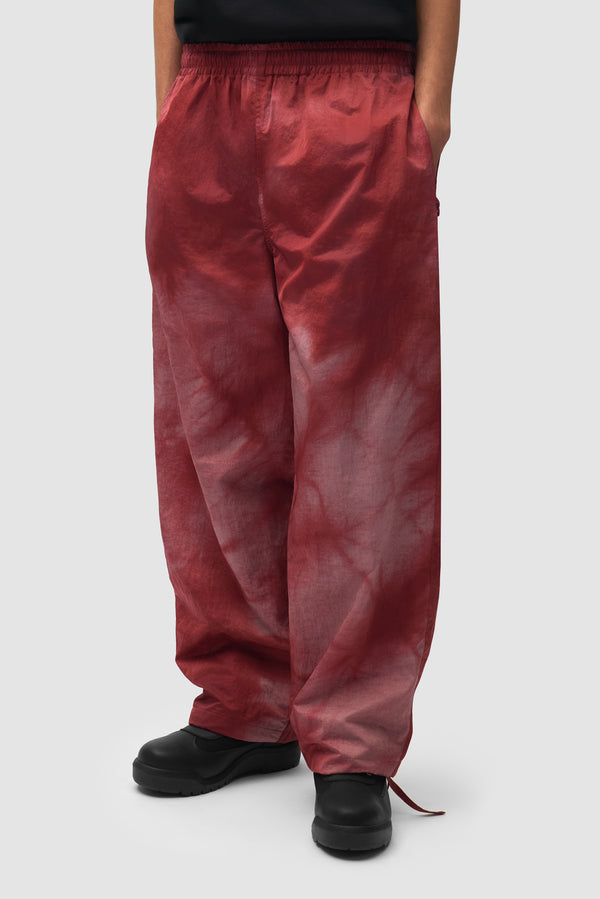 Sunfade Aero Track Pants in Bordeaux worn by a model, half-body front view