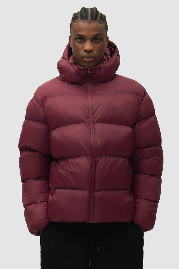 Hooded Puffer in Bordeaux worn by a model, half-body front view