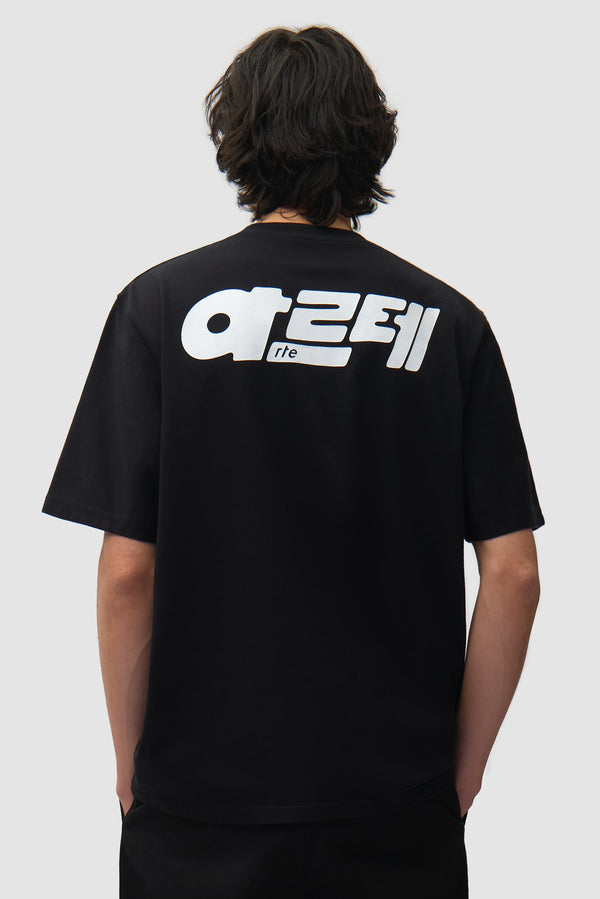 아르테 T-shirt in Black worn by a model, half-body back view