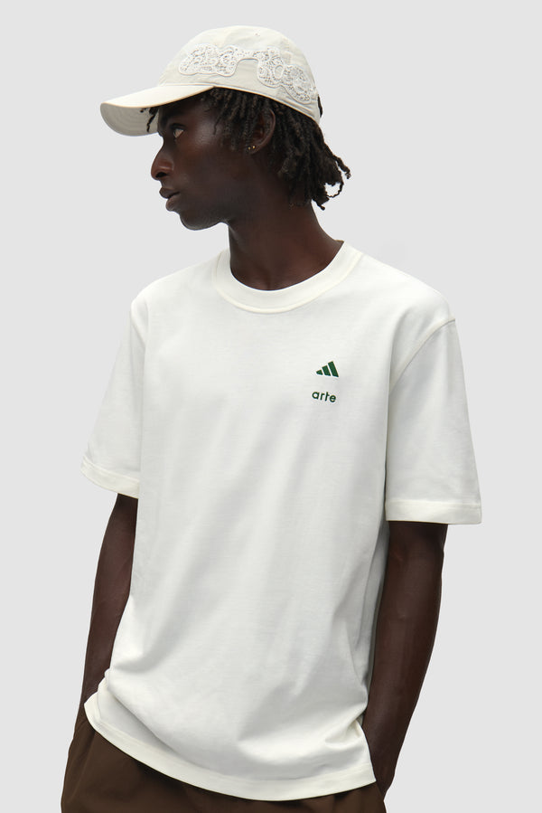 Arte for adidas Cap in White worn by a model, half-body side view