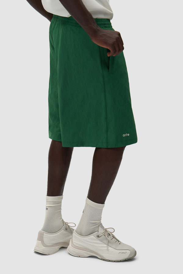 Arte for adidas Shorts in Green worn by a model, half-body side view