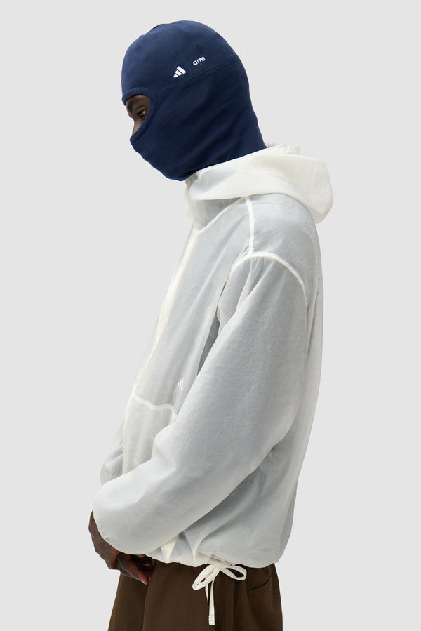 Arte for adidas Balaclava in Collegiate Navy worn by a model, half-body side view