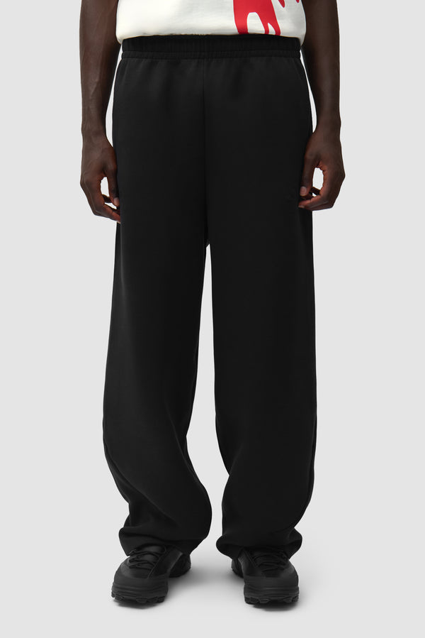 Arte for adidas Z.N.E. Track Pants in Black worn by a model, half-body front view